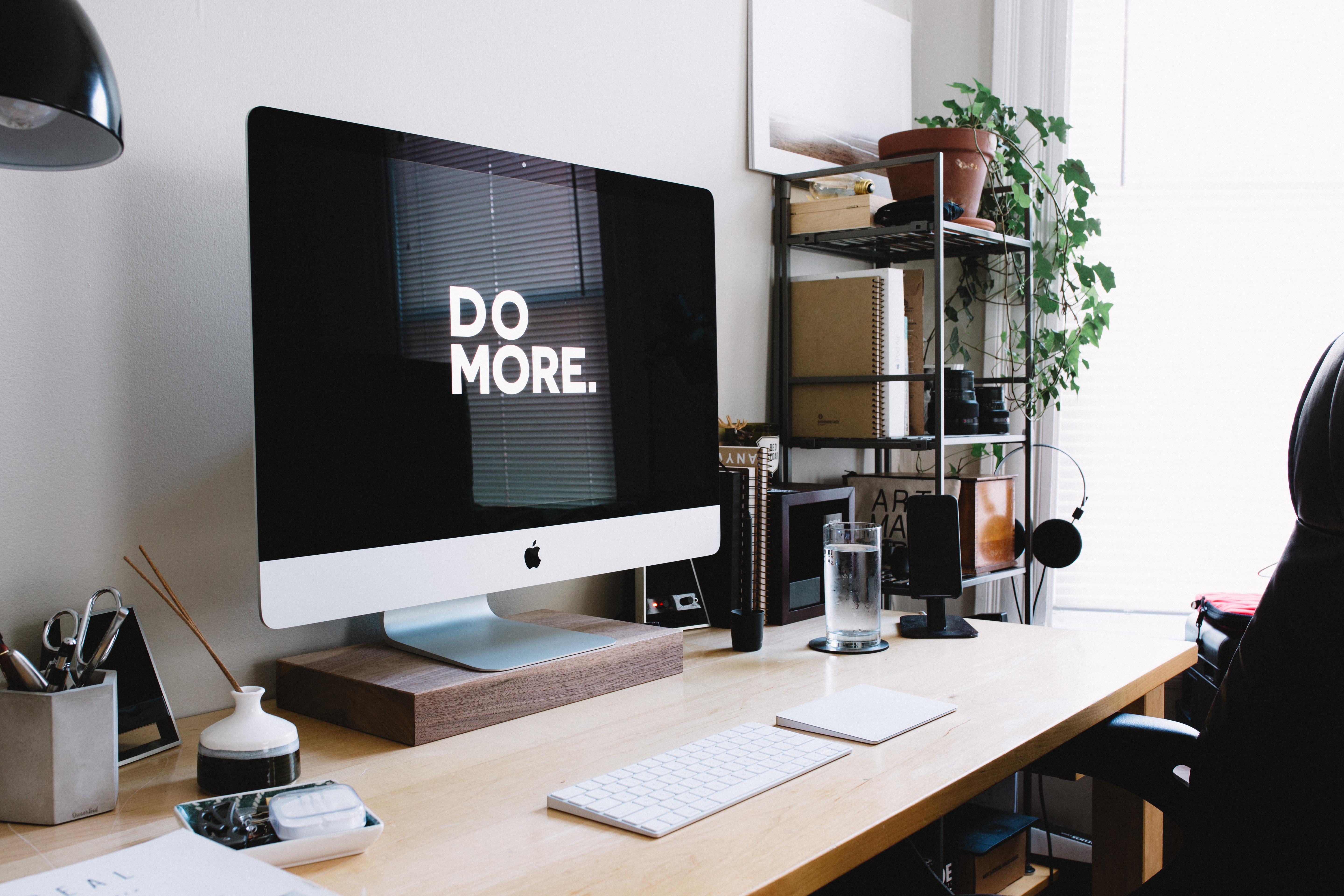 Blog header picture, office with a computer screen featuring the words 'Do More'